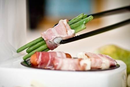Cooking Vegetables Wrapped In Bacon