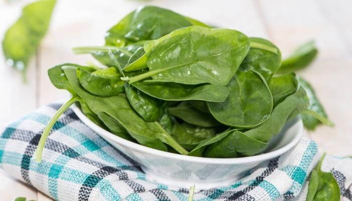 bowl of fresh spinach leaves