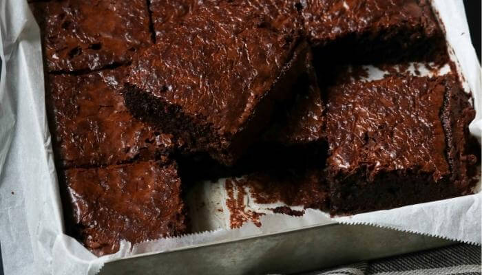 brownies in pan with parchment paper