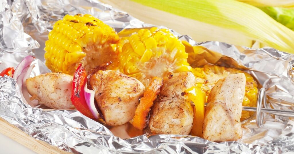 chicken skewer wrapped in aluminum foil