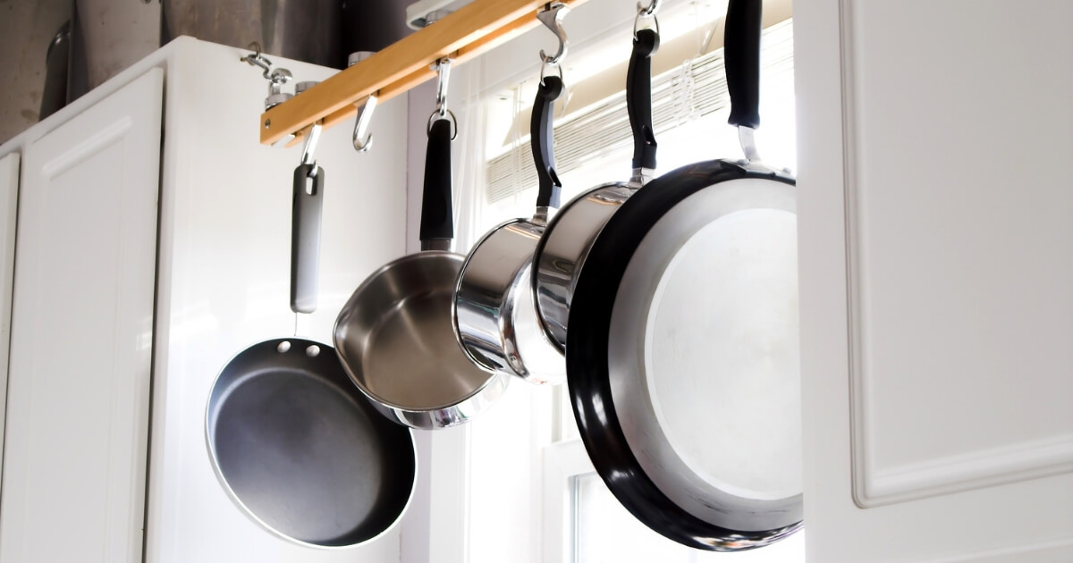 cookware guides hanging pots pans in kitchen