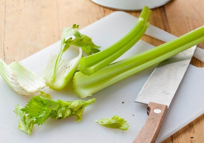 cut celery on chopping board
