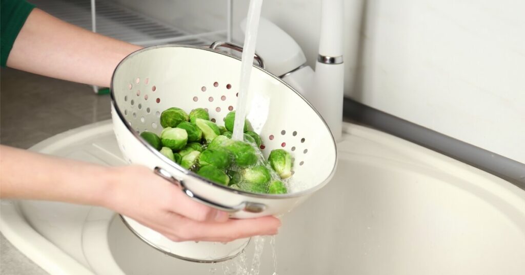draining brussels sprouts in colander