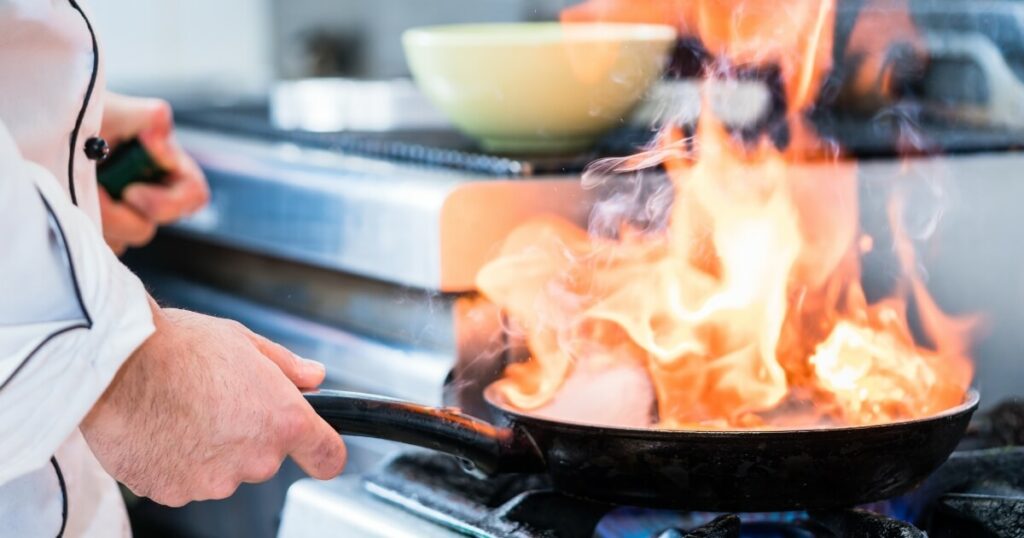 flambe in pan with large flames