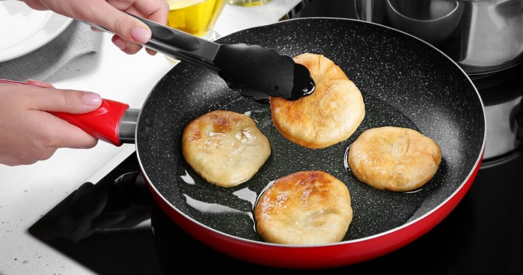 frying pancakes with oil in nonstick pan