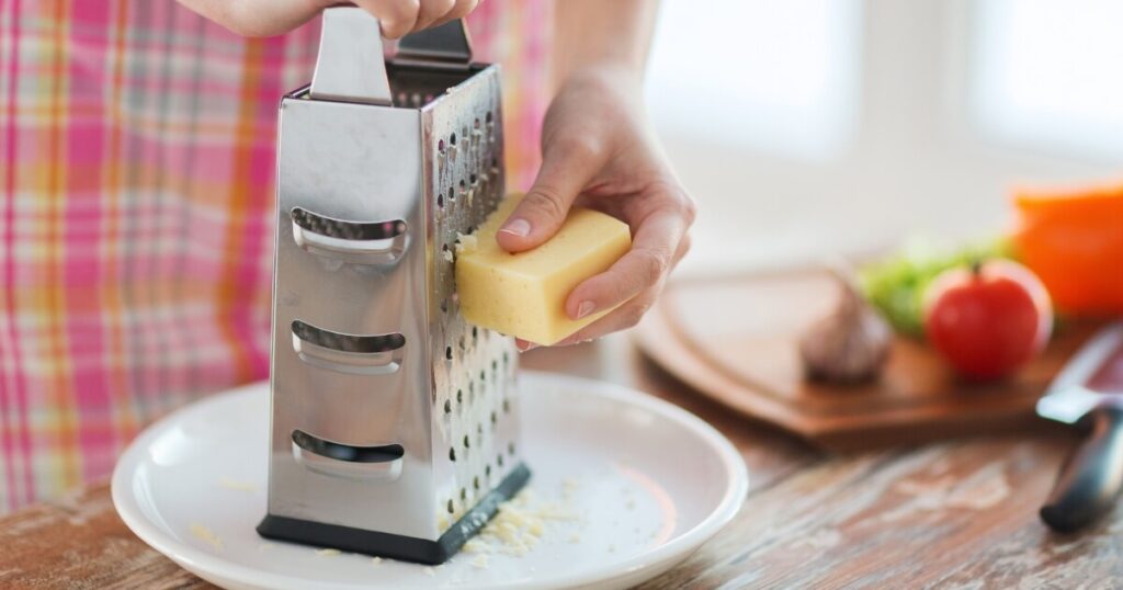 grating cheese with box grater