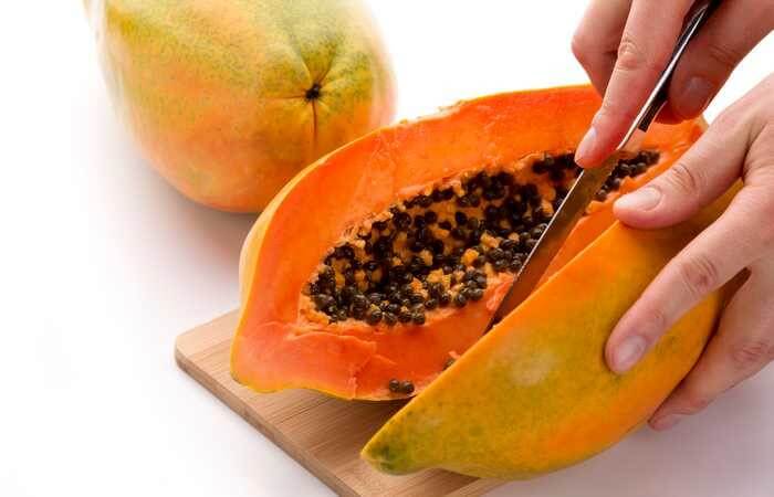 how to cut papaya step 4 slice in half