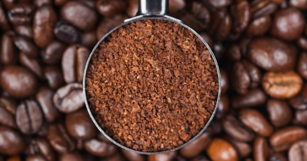 measuring ground coffee with scoop