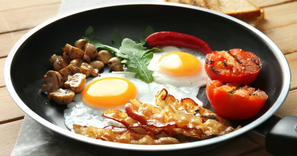 cooked breakfast foods in a nonstick pan