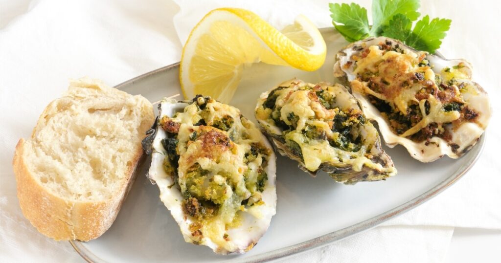 oyster rockefeller with bread and lemon
