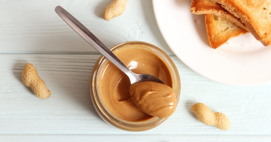 peanut butter with spoon in jar