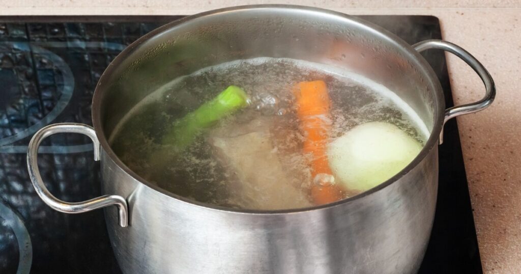 simmering stock in a pot