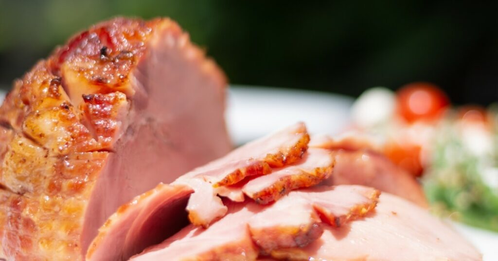 sliced ham dinner on table