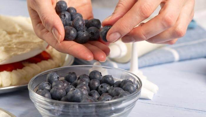 sorting blueberries