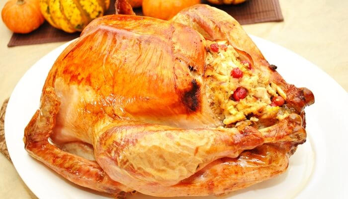 whole turkey with stuffing and cranberries